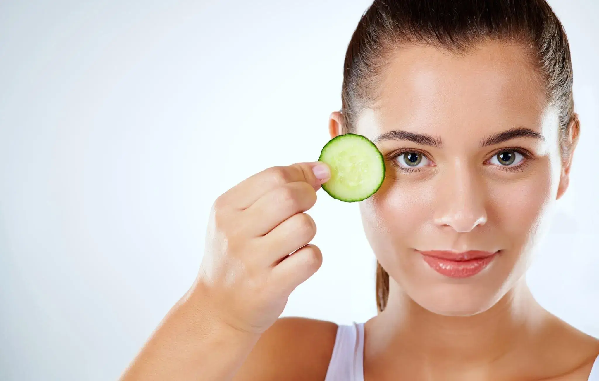 Woman applying natural foundation as part of an organic beauty routin
